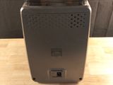 a toaster that is sitting on a wooden table