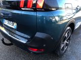 a close up of the rear end of a blue car
