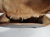 a close up of a hat on a white surface