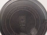 an image of a frying pan on a white surface