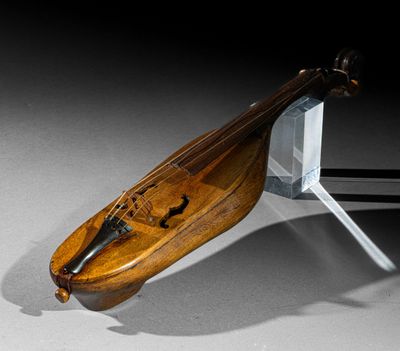 a wooden instrument that is sitting on a stand