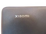 a close up of a black cell phone with the word imoxix on it