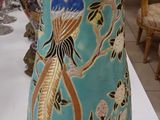 a vase that is sitting on a table in a room