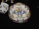 a plate with a design on it next to a pair of scissors and a pair of scissors