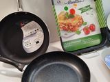 a frying pan, a frying pan, a frying pan and a frying pan sitting on a counter