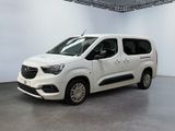 the white van is parked in a large room with white walls