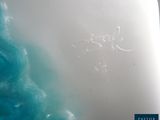 a close up picture of a person surfing on a wave