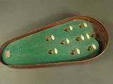 a green case with holes in it on a table
