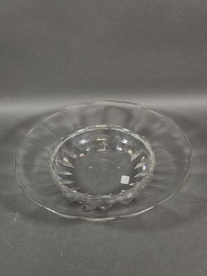 a glass bowl with a small bowl on top of it
