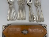 five forks and a spoon in a wooden case