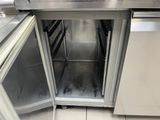 a stainless steel oven with a door open in a kitchen