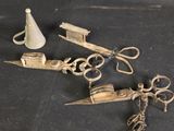a pair of scissors and a pair of scissors on a table