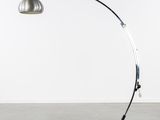 a black and silver floor lamp with a metal base