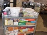 a cart that has many items on it in a warehouse