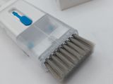 a toothbrush that is sitting on a table next to a box of toothpaste