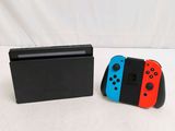 two nintendo wii controllers sitting next to each other on a table