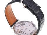 an image of a close up of a watch on a white surface