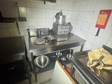 an image of a kitchen with a stove, sink, and oven