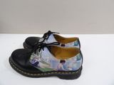 dr martenson shoes with a picture of a woman in a park