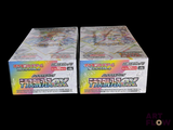 two boxes of pokemon trading cards on a black background
