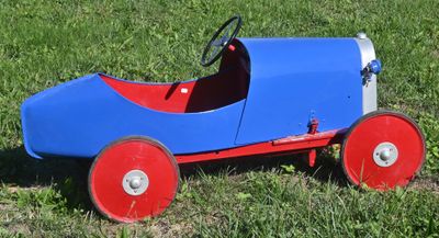 a toy car that is sitting in the grass