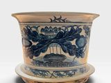 an image of a blue and white vase with a bird on it