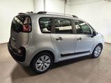 the small silver car is parked in the garage