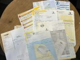 a lot of papers that are on a table