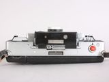a silver and black camera with a strap on it