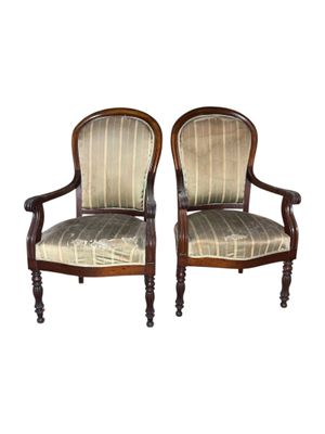 pair of antique chairs with upholstered upholstered back and arms