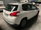 a picture of a white car parked in a garage