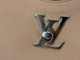 a close up of a louis vu bag on a table