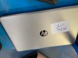 a laptop that has a sticker on the back of it