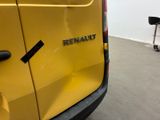the rear end of a yellow van with the word renault written on it