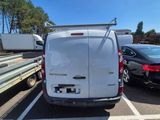 a white van that is parked in a parking lot