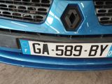 the front of a blue car with a license plate on it ' s bumper