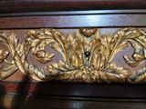 a close up of a decorative piece of furniture