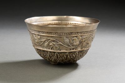a silver bowl that is sitting on a table