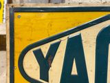 a yellow and black sign with the word day on it