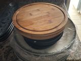 a wooden cutting board on top of a stove