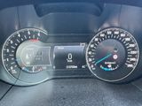 a close up of a car dashboard with a speedometer and gauges