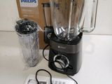 a blender that is sitting on a table next to a box