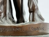 a bronze statue of a man and a woman holding hands