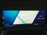the dashboard of a car with a gps device on it ' s display