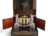 a wooden case with a set of wine glasses in it