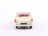 a small toy car that is sitting on a white surface