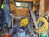 the back of a van with a bunch of tools in the back