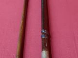 pair of old canes on a pink table cloth