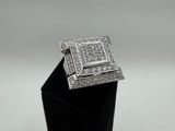 a close up of a small black box with a diamond ring on it