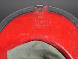 a red hat with a black band on it
